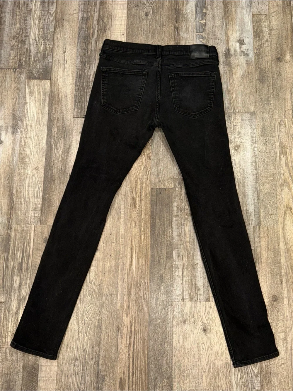 Men’s Hollister Black Stacked Skinny Jeans with Red Plaid Patch